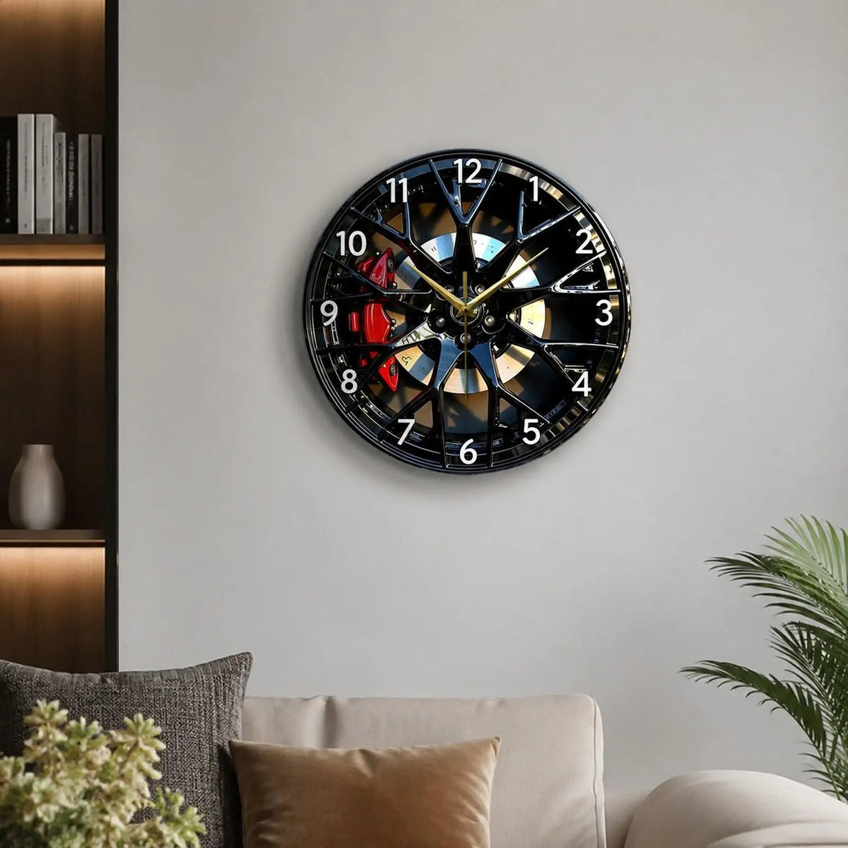 A round acrylic wall clock with a black face and gold hands displaying the time, mounted on a gray wall.