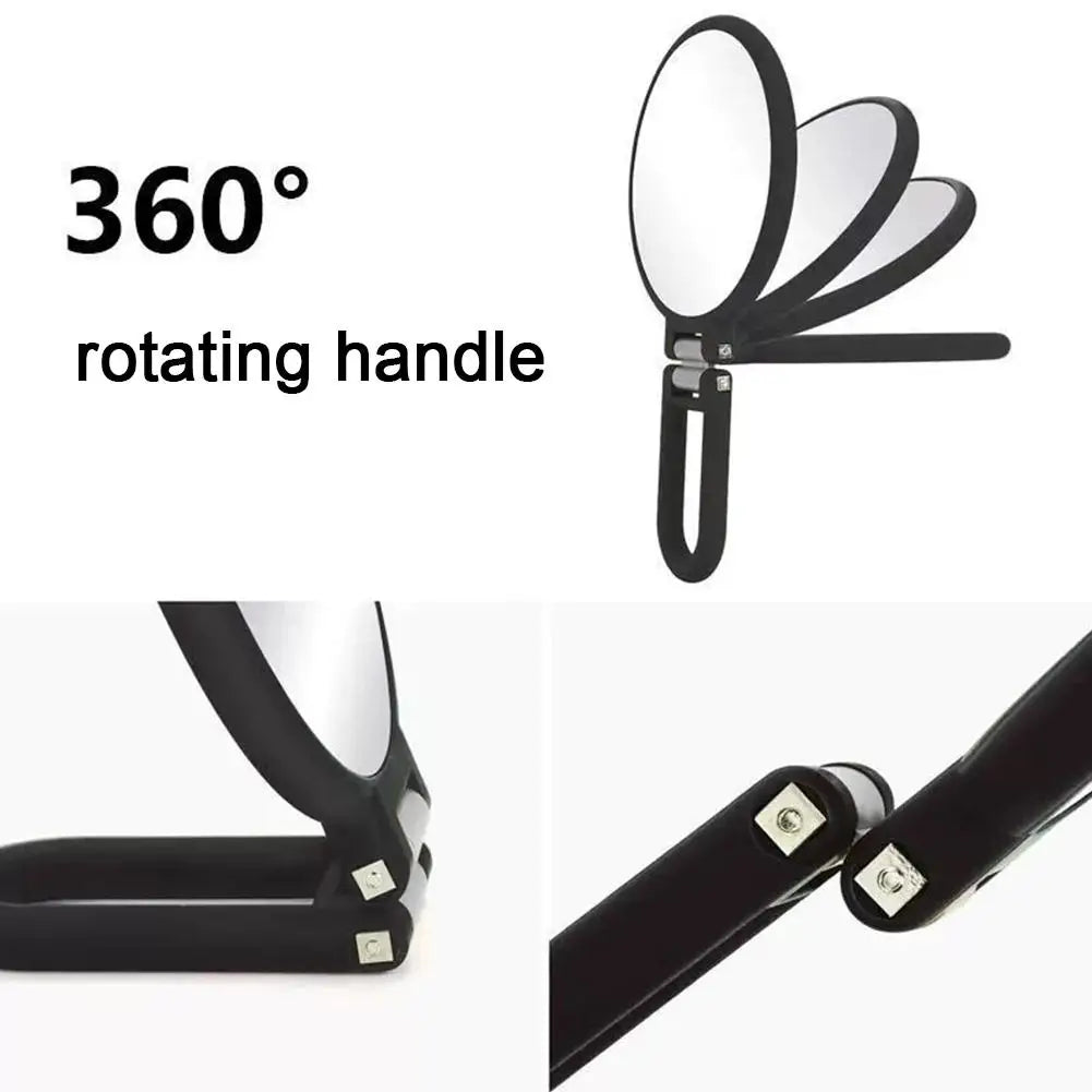 A black handheld mirror with a 360-degree rotating handle, showing the mirror and the grip.