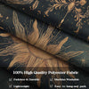 A close-up of a dark teal fabric featuring gold botanical and celestial designs, showing the texture and weave.
