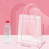 Clear reusable PVC gift bags with handles displayed next to a water bottle and size measurements.