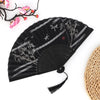 Black vintage bamboo folding fan with gray line patterns and pink floral accents