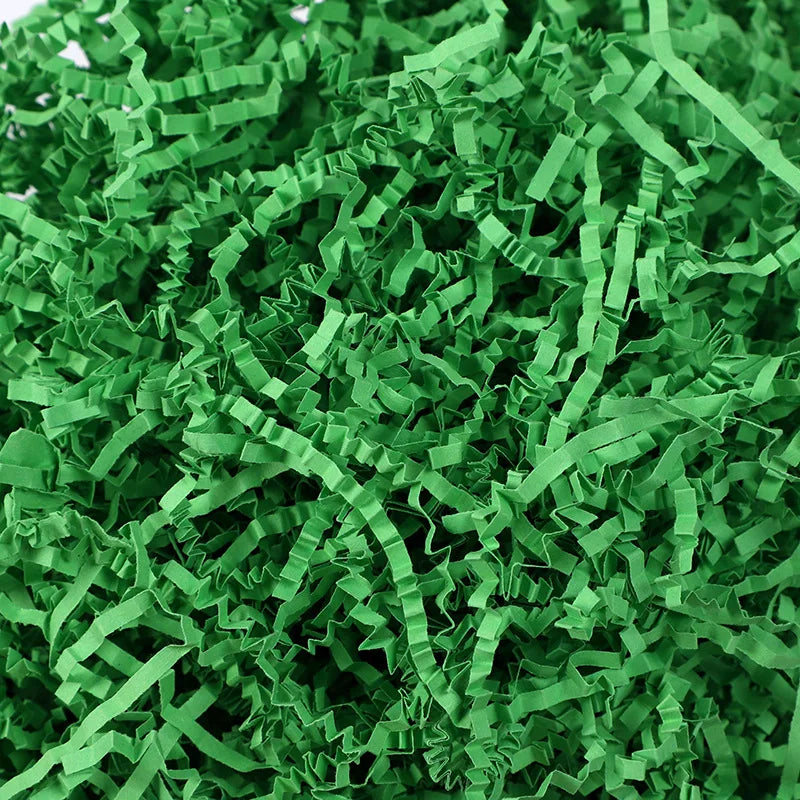 Green crinkle paper shred filler used for Halloween treat bags and décor