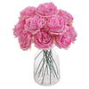 A bouquet of six pink silk peony flowers arranged in a clear glass vase.