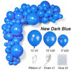 A bundle of new dark blue latex balloons, ribbon, chain, and glue for party decor.
