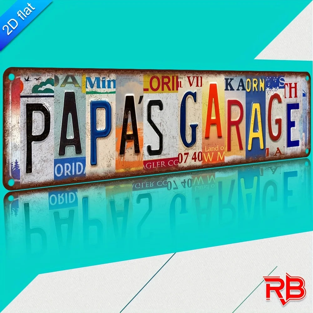 Vintage aluminum metal wall art sign with the text Papa's Garage on a distressed metal background