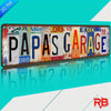Vintage aluminum metal wall art sign with the text Papa's Garage on a distressed metal background