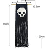 Tapis mural en macramé noir avec motif crâne et franges longues