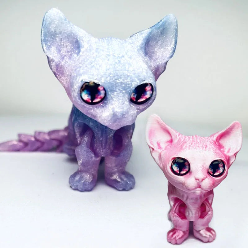 A pair of articulated 3D printed figurines depicting a purple and pink Siamese cat with iridescent eyes.