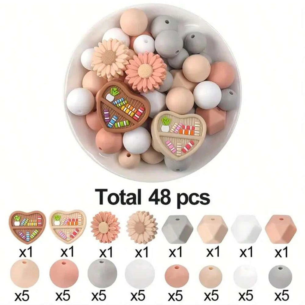 A bowl filled with 48 silicone beads in various natural and pastel colors for DIY jewelry and crafts