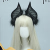 A light blonde wig is shown wearing black bat simulation headwear with feathered ears.