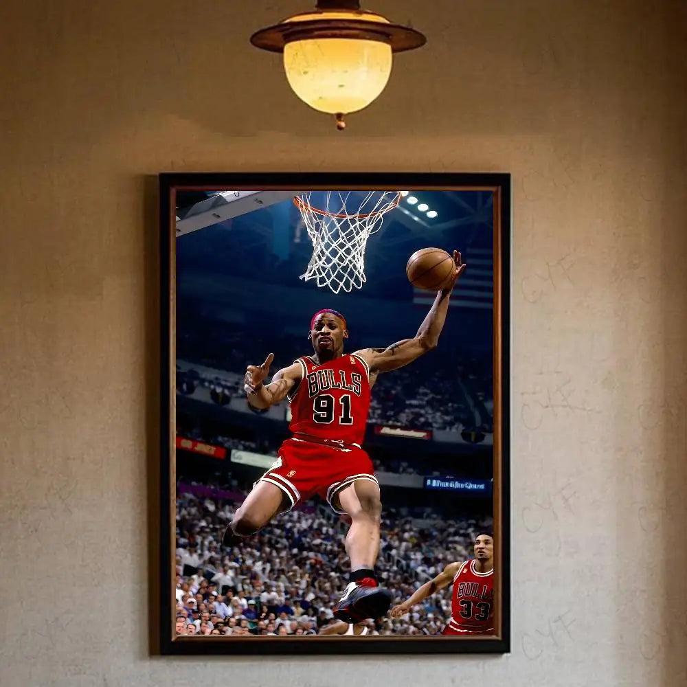 A framed photograph of Dennis Rodman playing basketball, jumping for a shot, against a blurred background.