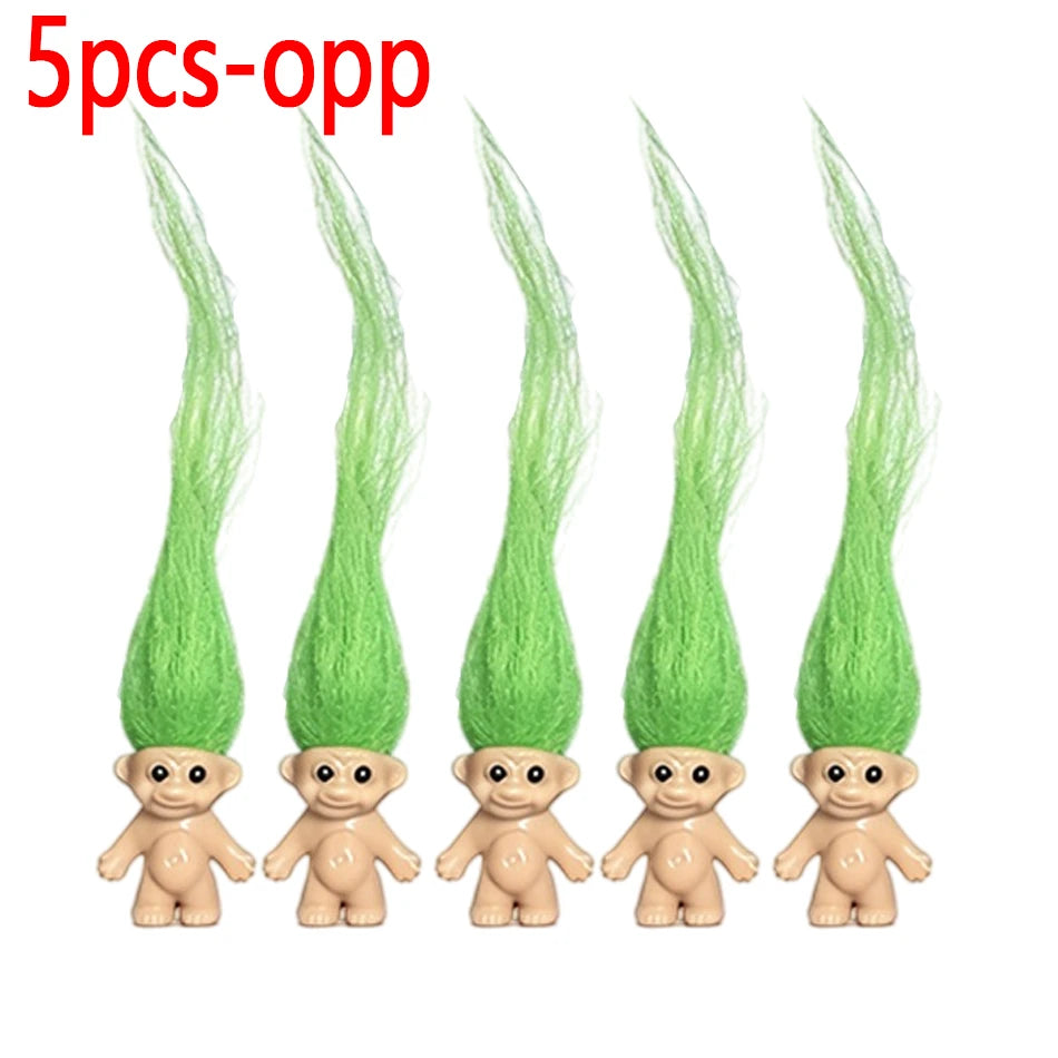 Five green troll doll figures with long hair and small bodies.
