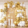 A large balloon garland featuring white and gold latex balloons with gold confetti, arranged against a light background.