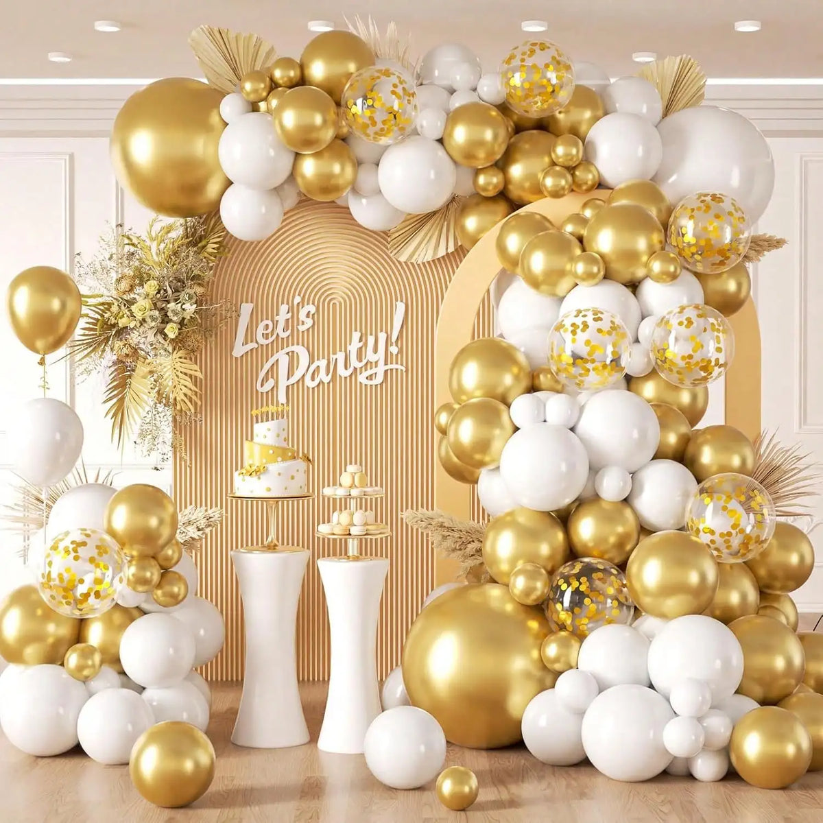 A large balloon garland featuring white and gold latex balloons with gold confetti, arranged against a light background.