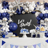 A balloon garland arch featuring navy blue and silver balloons decorating a table setup for a party.
