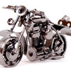 A handcrafted metal motorcycle model featuring chrome details and a vintage diecast display piece.