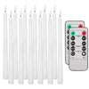A set of six white flamed taper candles and a remote control with timer and light settings.