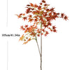 A tall artificial maple tree with reddish-orange silk leaves on a bare branch, shown without a pot.