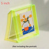 A clear acrylic photo frame with a yellow frame and a message board featuring an orange flower design.