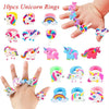 A collection of 10 unicorn rings in various colors and designs displayed on a hand.