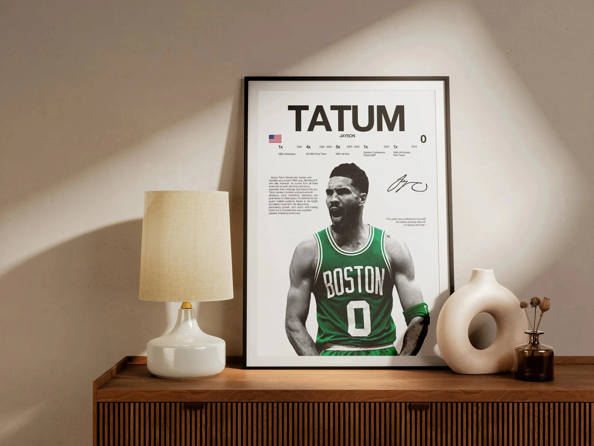 A framed poster featuring a portrait of a basketball player named Tatum with the text TATUM and a Boston Celtics jersey.