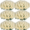 A collection of white artificial silk roses arranged in bouquets for table decor.