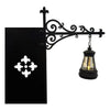 Black wrought iron wall sconce lamp with a glass shade and soft warm glow