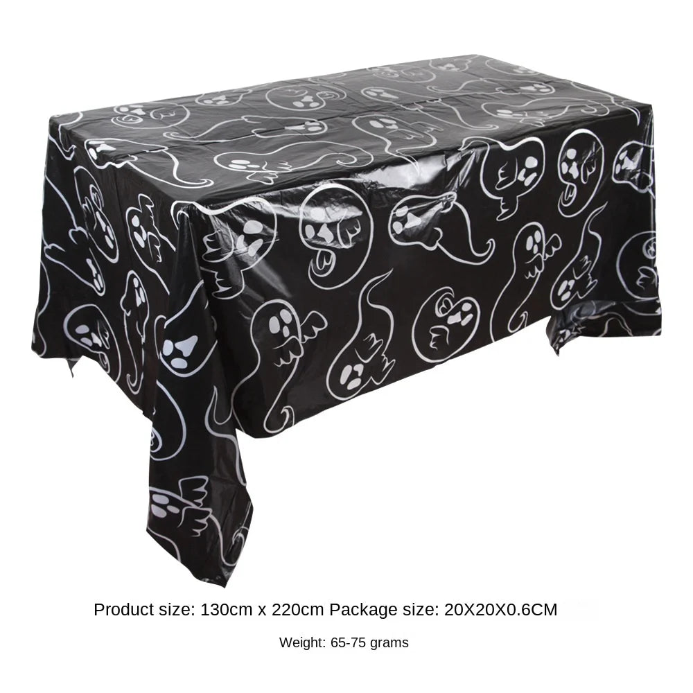 Black Halloween tablecloth featuring a pattern of ghosts, pumpkins, spider webs, and bats.