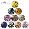 A collection of various leopard print glass cabochons for jewelry making in different colors and patterns.