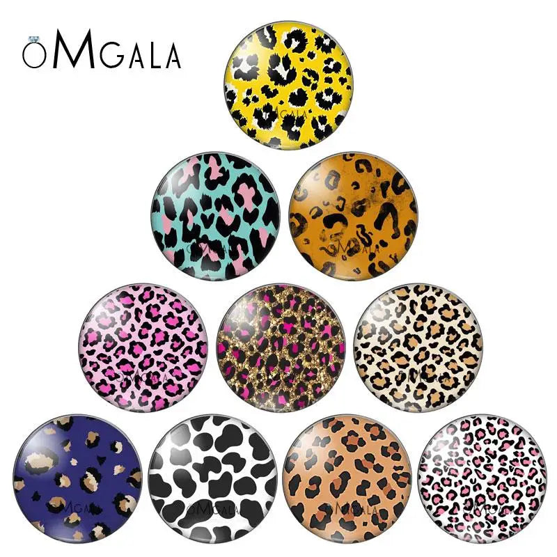 A collection of various leopard print glass cabochons for jewelry making in different colors and patterns.