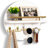 A circular wooden wall key holder with a shelf displaying various keys and jewelry.