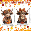 A set of two rustic wooden Highland cow figurines decorated with autumn leaves and pumpkins.