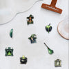 A collection of decorative stickers featuring forest witch themes, including a witch face, a witch hat, and other nature-insp