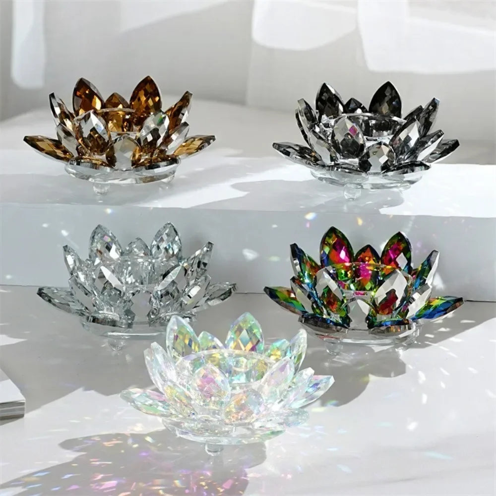 A collection of crystal lotus candle holders in various colors and sizes displayed on a white surface.