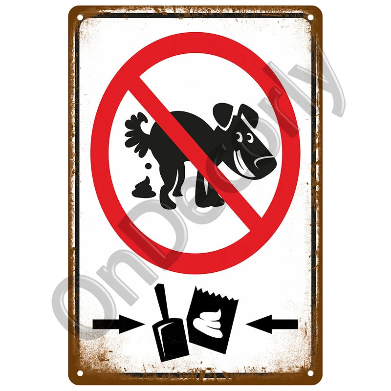 A vintage metal sign with a red circle and diagonal line prohibiting the use of a security camera.
