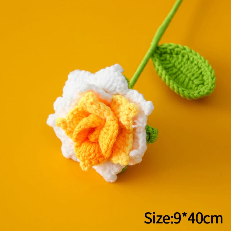 Handmade crochet tulip bouquet featuring white and orange flowers on a green stem