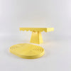A set of two yellow cupcake stands with ruffled edges, displayed against a white background.