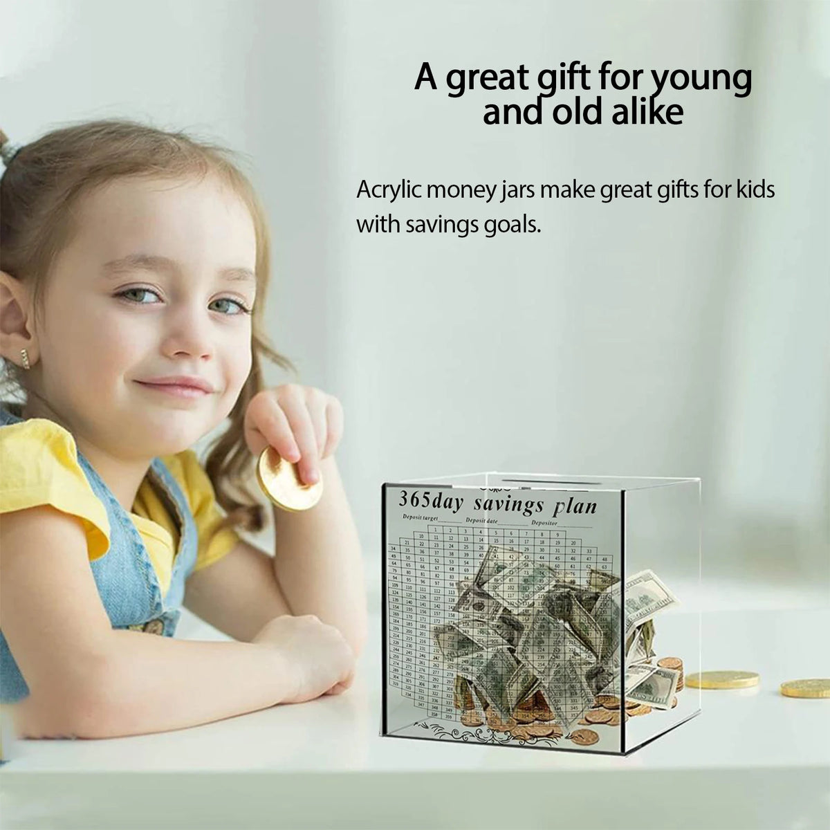 A young girl smiles while holding a clear acrylic money jar savings plan box.