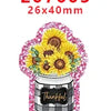 Pink glitter acrylic charms featuring yellow flowers and a black and white plaid jar.