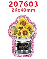 Pink glitter acrylic charms featuring yellow flowers and a black and white plaid jar.
