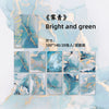 A pack of bright and green gradient wash retro decorative paper sheets featuring blue, teal, and gold marbled textures.