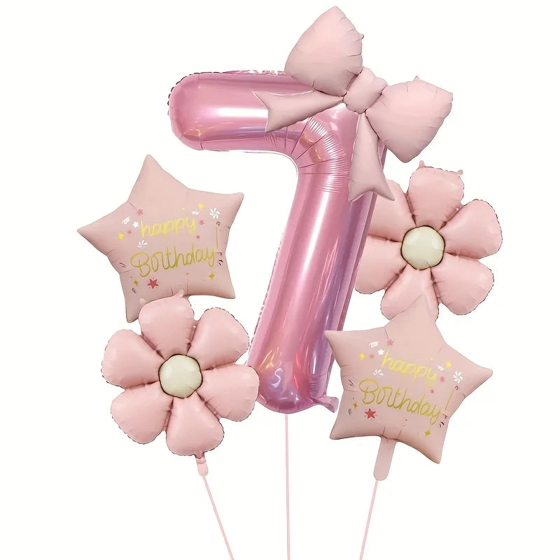 Pink foil balloons shaped like the number 1 and a flower, with glitter text reading Happy Birthday