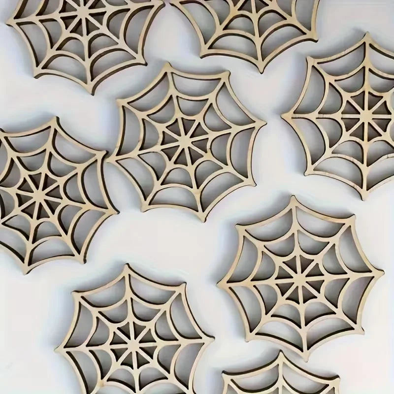 A collection of intricately cut wooden spider web ornaments in a natural wood tone.