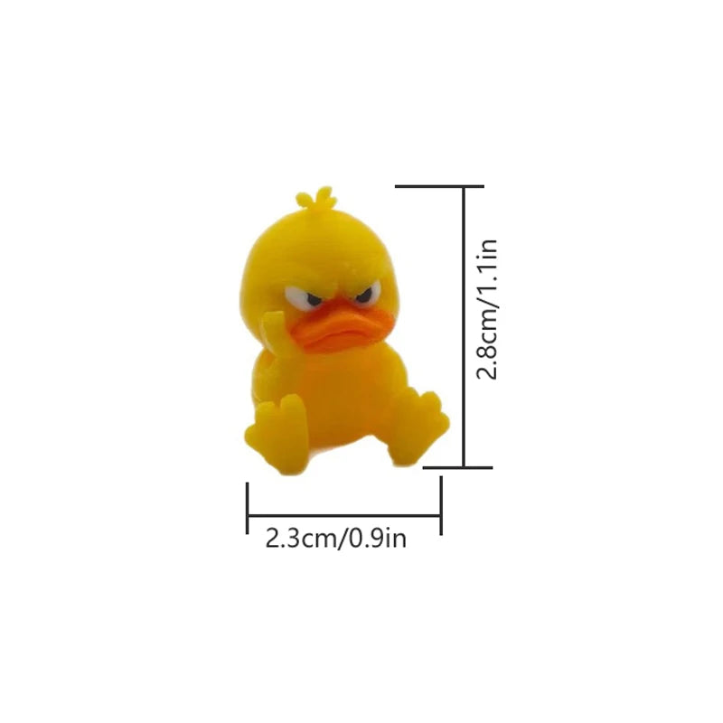 A yellow 3D printed statue of an angry duck with a yellow comb, shown from the front.