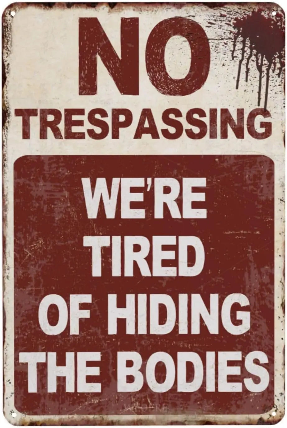 A vintage tin sign with a distressed texture displaying the text NO TRESPASSING WE'RE TIRED OF HIDING THE BODIES