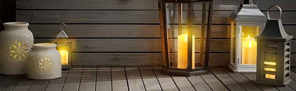A display of various glass and ceramic lanterns holding realistic flickering LED candles on a wooden surface.