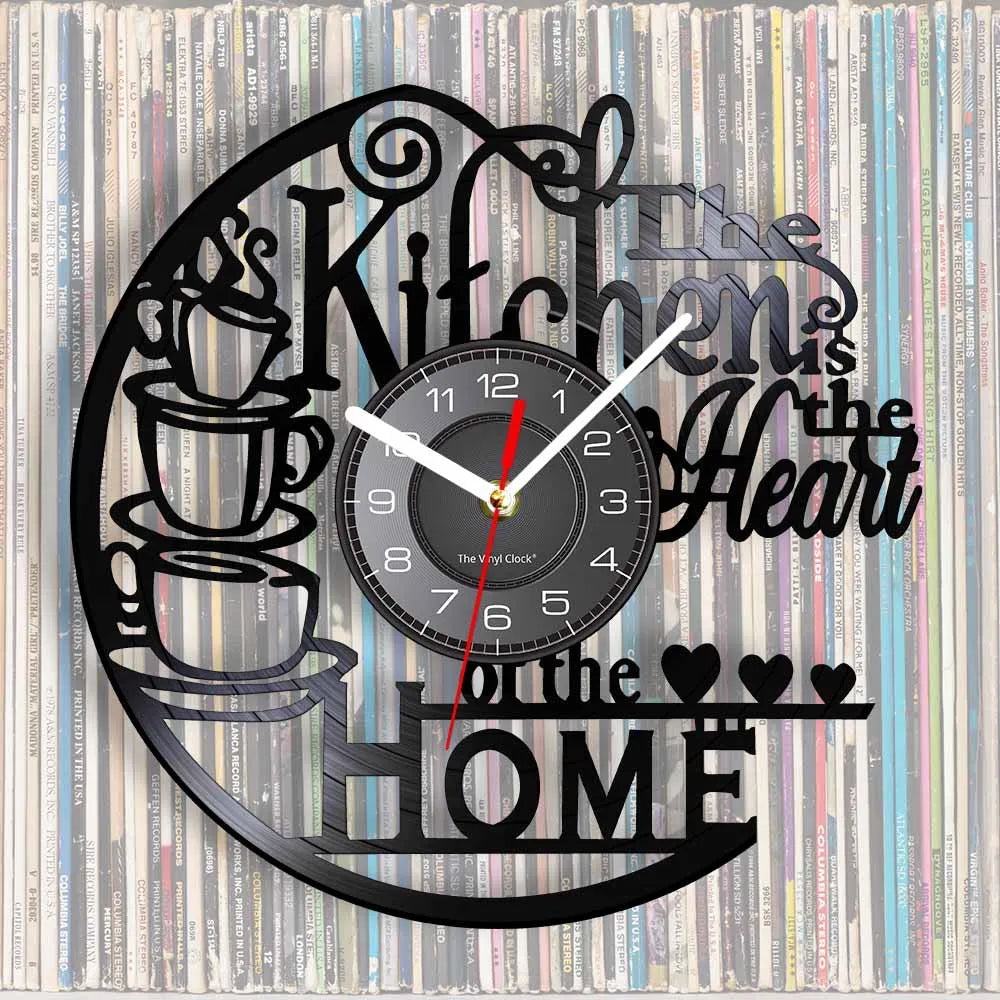 A black wall clock design featuring a coffee cup silhouette and text that reads Kitchen is the Heart of the Home
