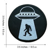 Black embroidered patch featuring a silhouette of Bigfoot standing inside a stylized helmet shape.