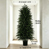 A tall artificial cedar topiary tree in a black pot displayed in a bright indoor setting.