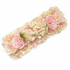A long panel of artificial silk rose flowers in soft pink and cream shades for weddings and events.